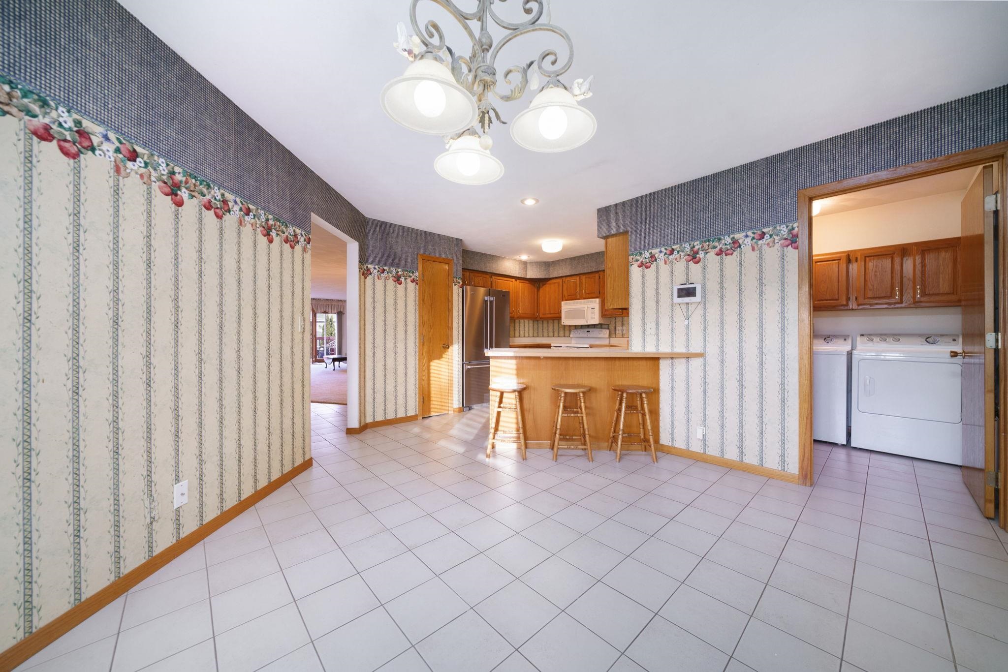 1196 South Trainer Road Rockford, IL 61108 - Photo 8 of 33 a view of a kitchen with a sink and cabinets