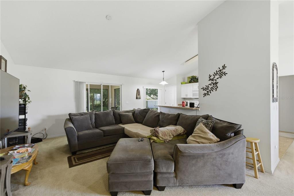 3959 Southwest 129th Street Ocala, FL 34473 - Photo 2 of 27 a living room with furniture and a window