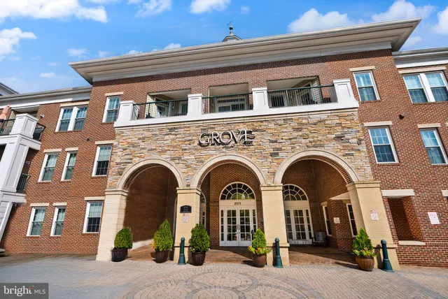 a front view of a building with many windows