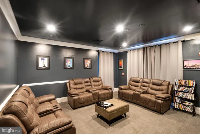 a view of a building with garden and sitting area