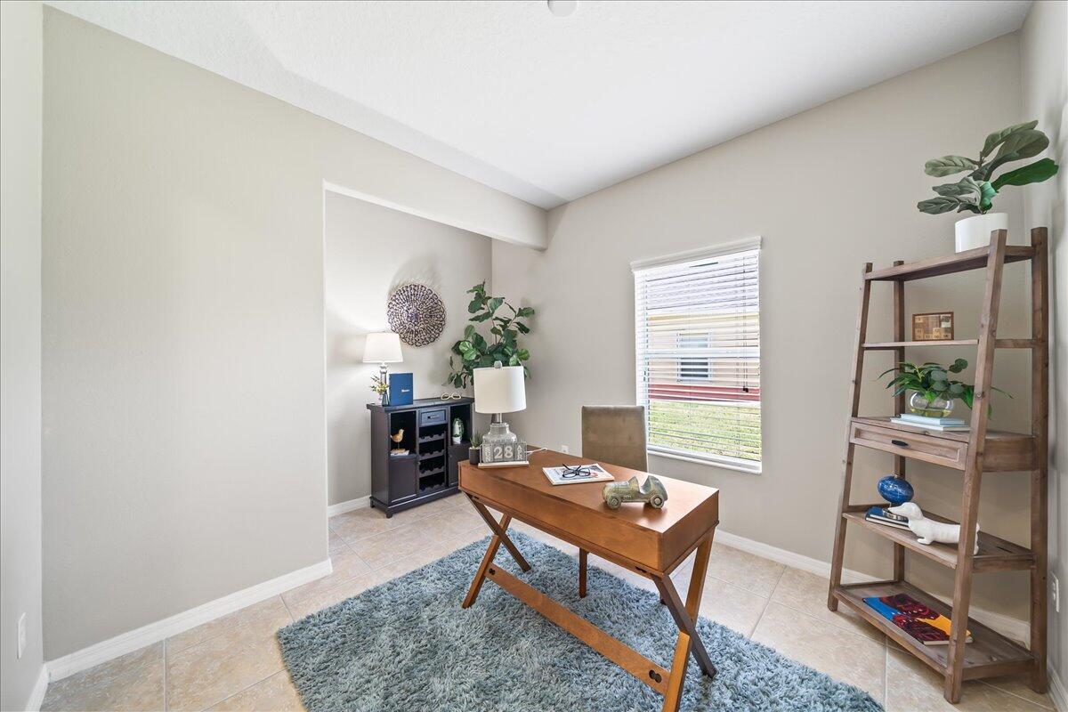 3795 Sansome Circle Melbourne, FL 32940 - Photo 12 of 76 a living room with furniture a rug and a window