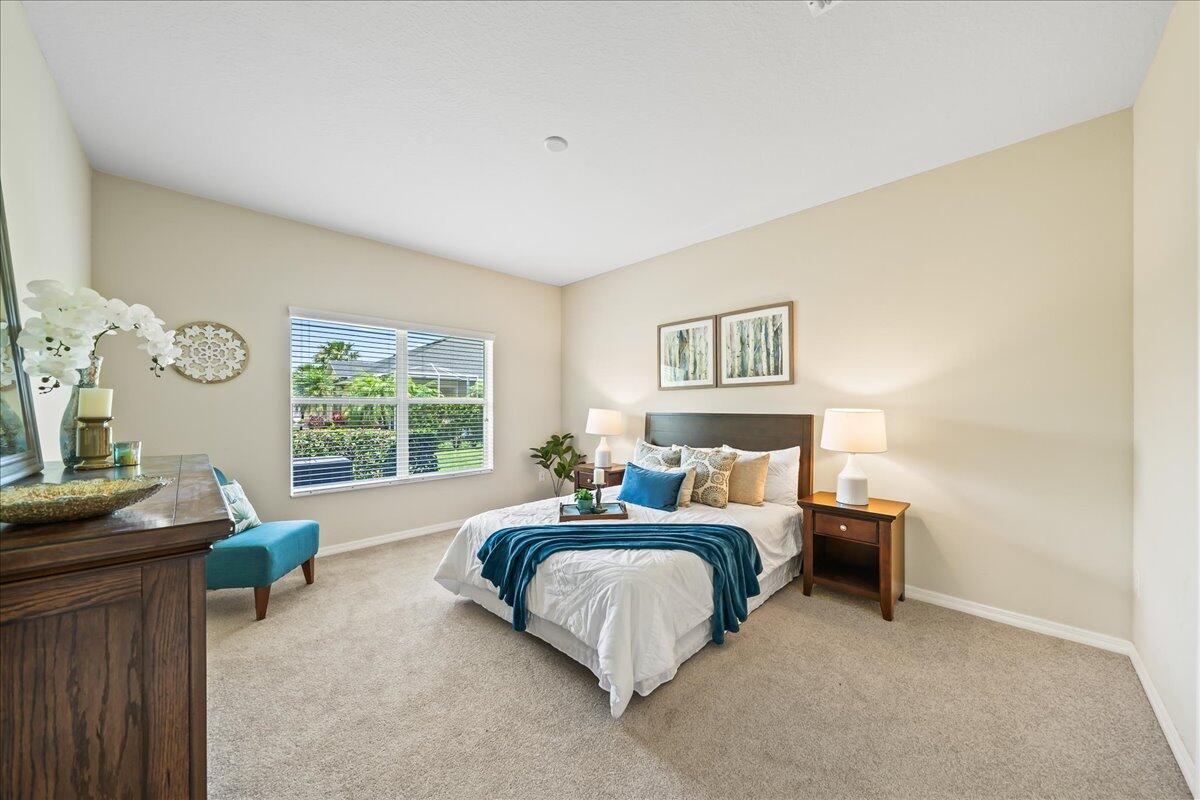 3795 Sansome Circle Melbourne, FL 32940 - Photo 13 of 76 a bedroom with a bed window and a table