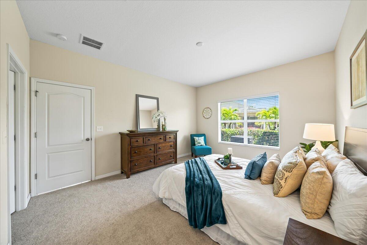 3795 Sansome Circle Melbourne, FL 32940 - Photo 14 of 76 a bedroom with furniture and a window