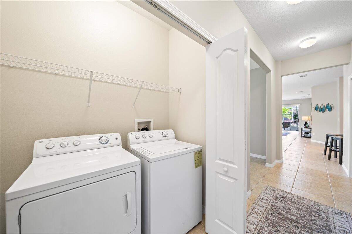 3795 Sansome Circle Melbourne, FL 32940 - Photo 22 of 76 a utility room with dryer and washer