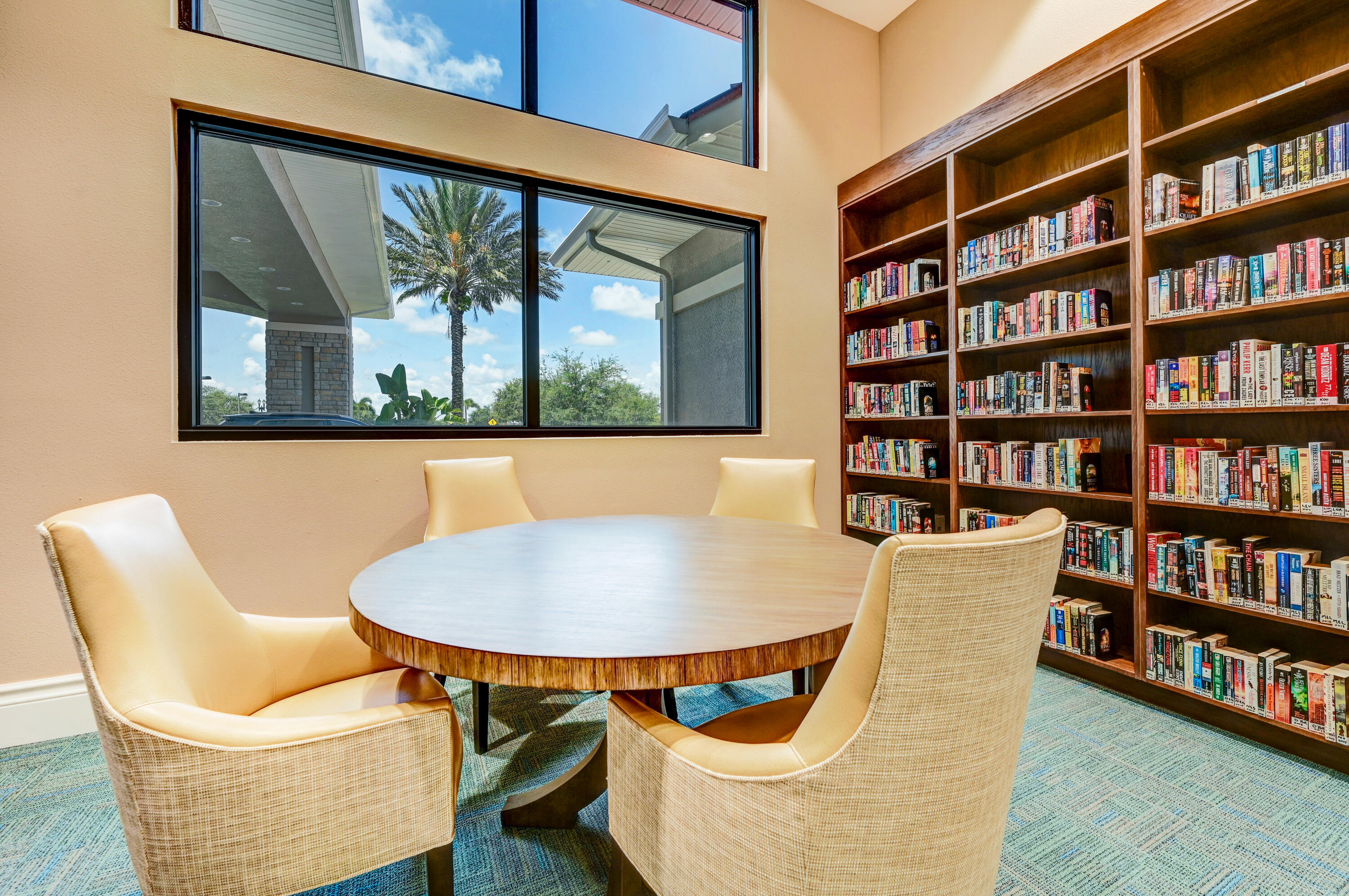 3795 Sansome Circle Melbourne, FL 32940 - Photo 48 of 76 a view of a dining room with furniture and a book shelf