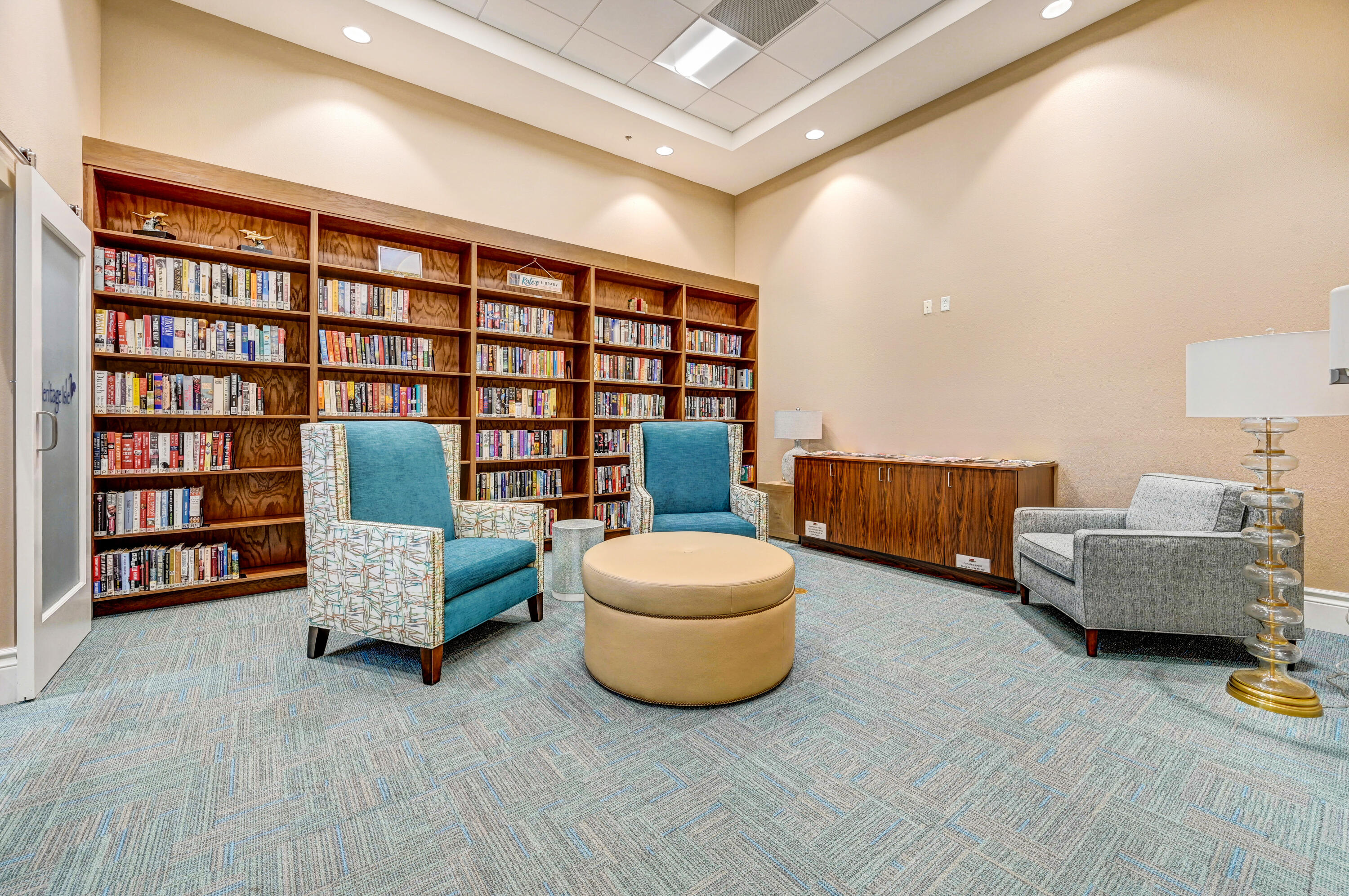 3795 Sansome Circle Melbourne, FL 32940 - Photo 52 of 76 a living room with furniture and a book shelf