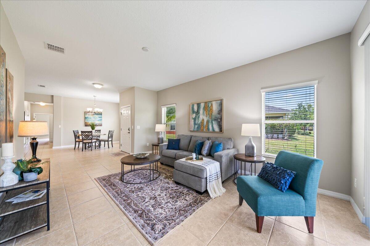 3795 Sansome Circle Melbourne, FL 32940 - Photo 6 of 76 a living room with furniture and a large window