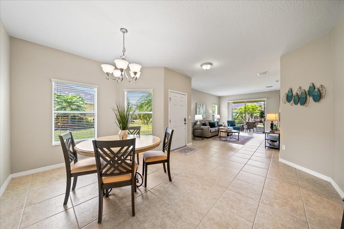 3795 Sansome Circle Melbourne, FL 32940 - Photo 7 of 76 a view of a dining room with furniture window and outside view
