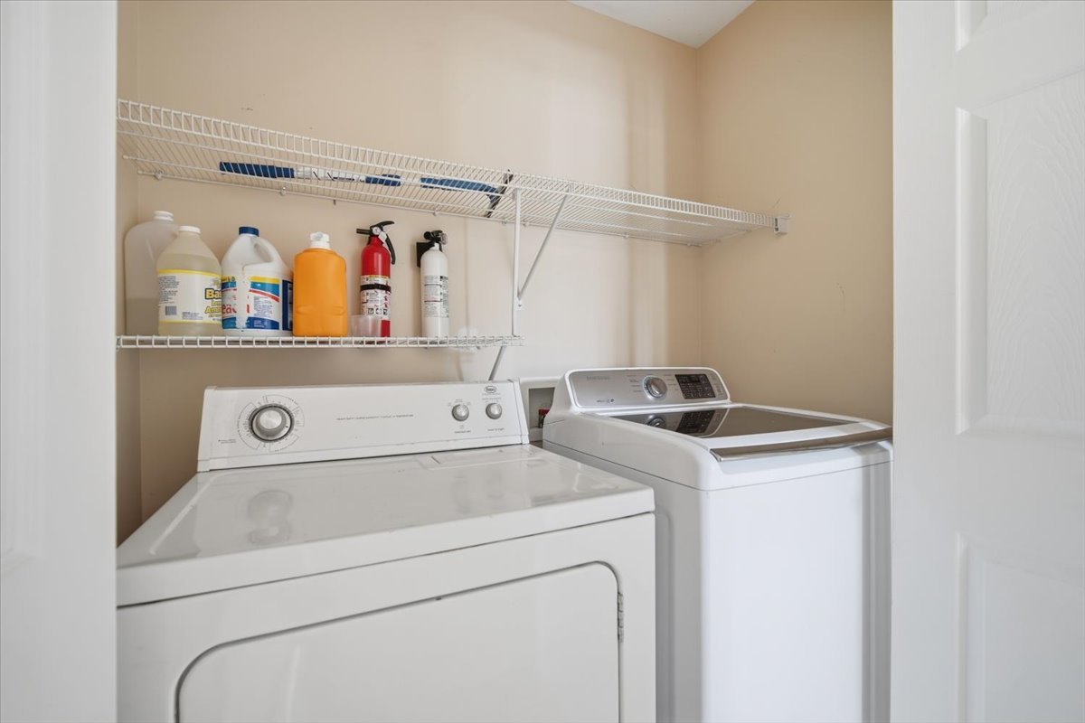 915 Teegan Street Normal, IL 61761 - Photo 14 of 33 a utility room with dryer and washer