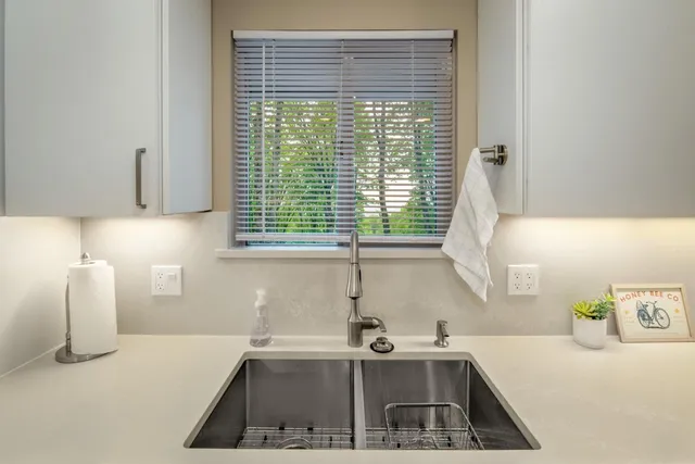 a kitchen with a sink and a window