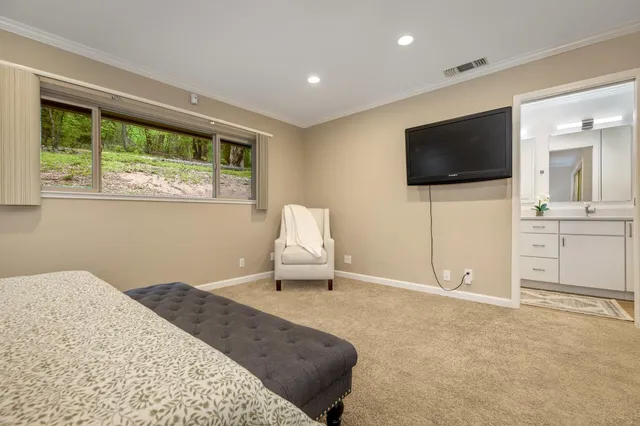 a bathroom with a double vanity sink toilet and shower