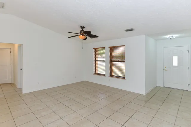 a view of an empty room and window