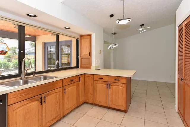 a kitchen with appliances and cabinets