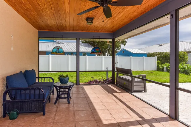 a view of a chairs and table in the patio
