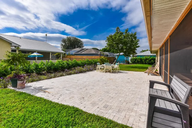 a view of a backyard with sitting area