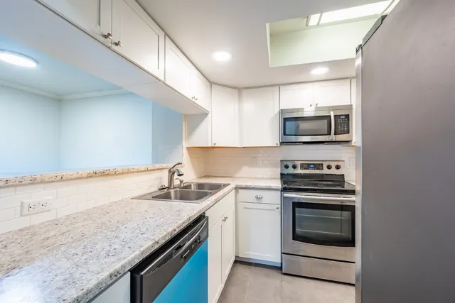 a kitchen with a stove and a microwave