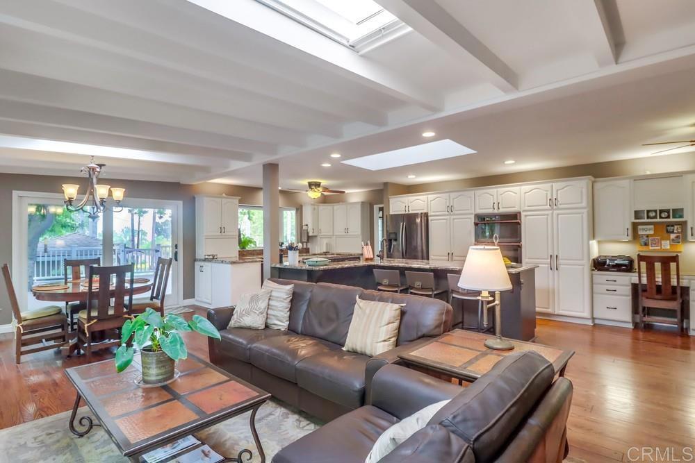 1601 Hidden Mesa Road El Cajon, CA 92019 - Photo 12 of 31 a living room with furniture wooden floor and a large window