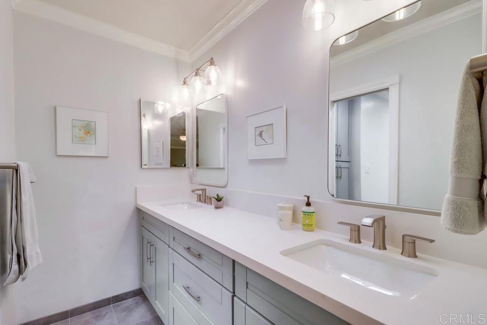 1601 Hidden Mesa Road El Cajon, CA 92019 - Photo 15 of 31 a bathroom with double vanity sinks and a mirror