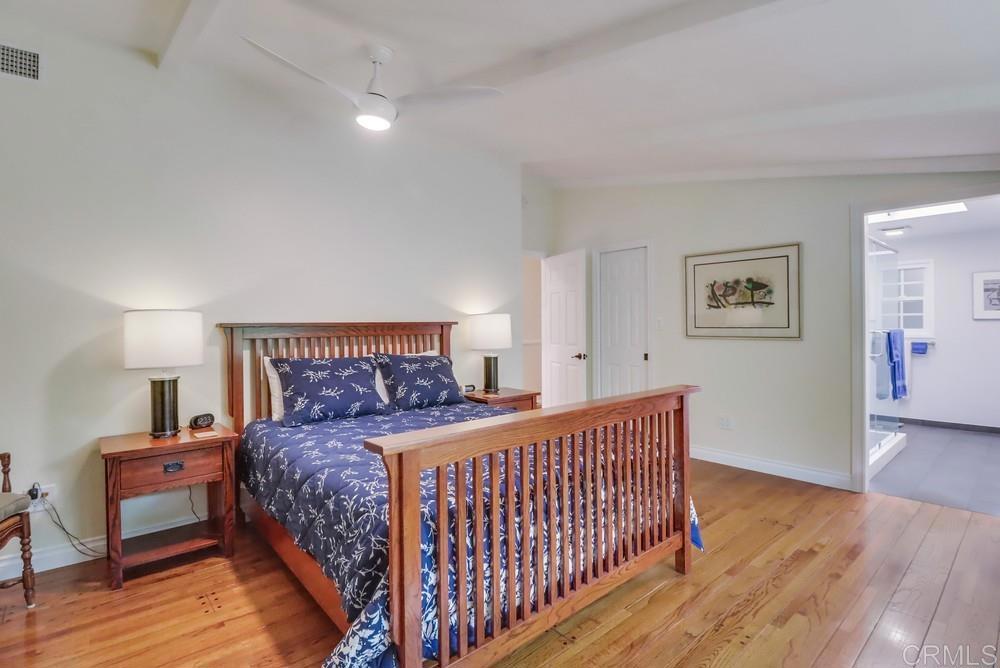 1601 Hidden Mesa Road El Cajon, CA 92019 - Photo 19 of 31 a bedroom with a bed and wooden floor