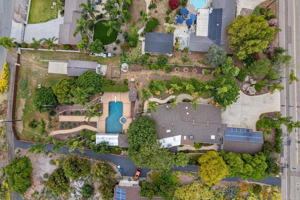 1601 Hidden Mesa Road El Cajon, CA 92019 - Photo 3 of 31 an aerial view of a house with a yard and garden