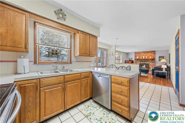 a kitchen with stainless steel appliances granite countertop a sink and cabinets