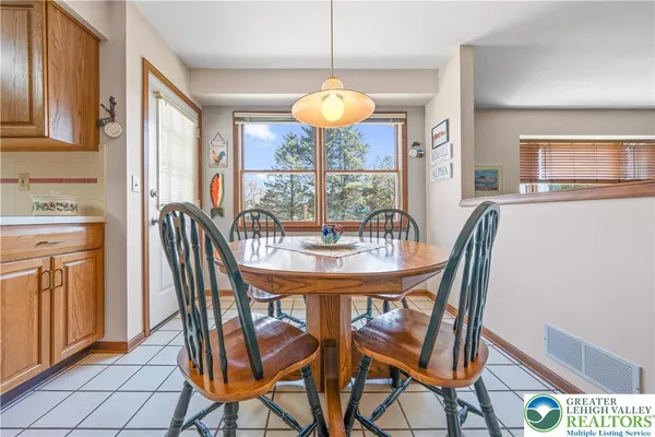 a view of a dining room with furniture window and outside view