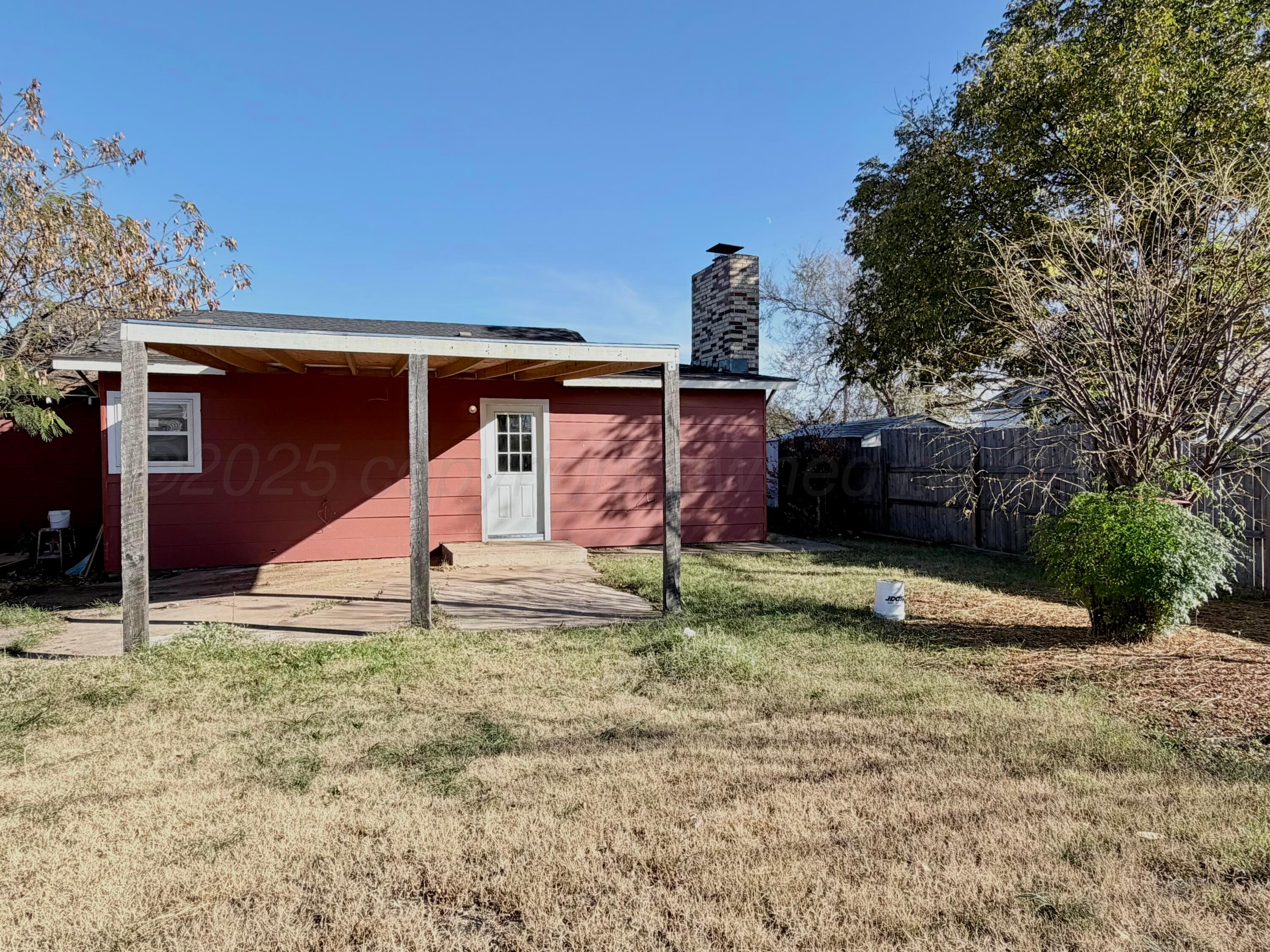 1409 El Paso Street Wellington, TX 79095 - Photo 22 of 22 a front view of a house with garden