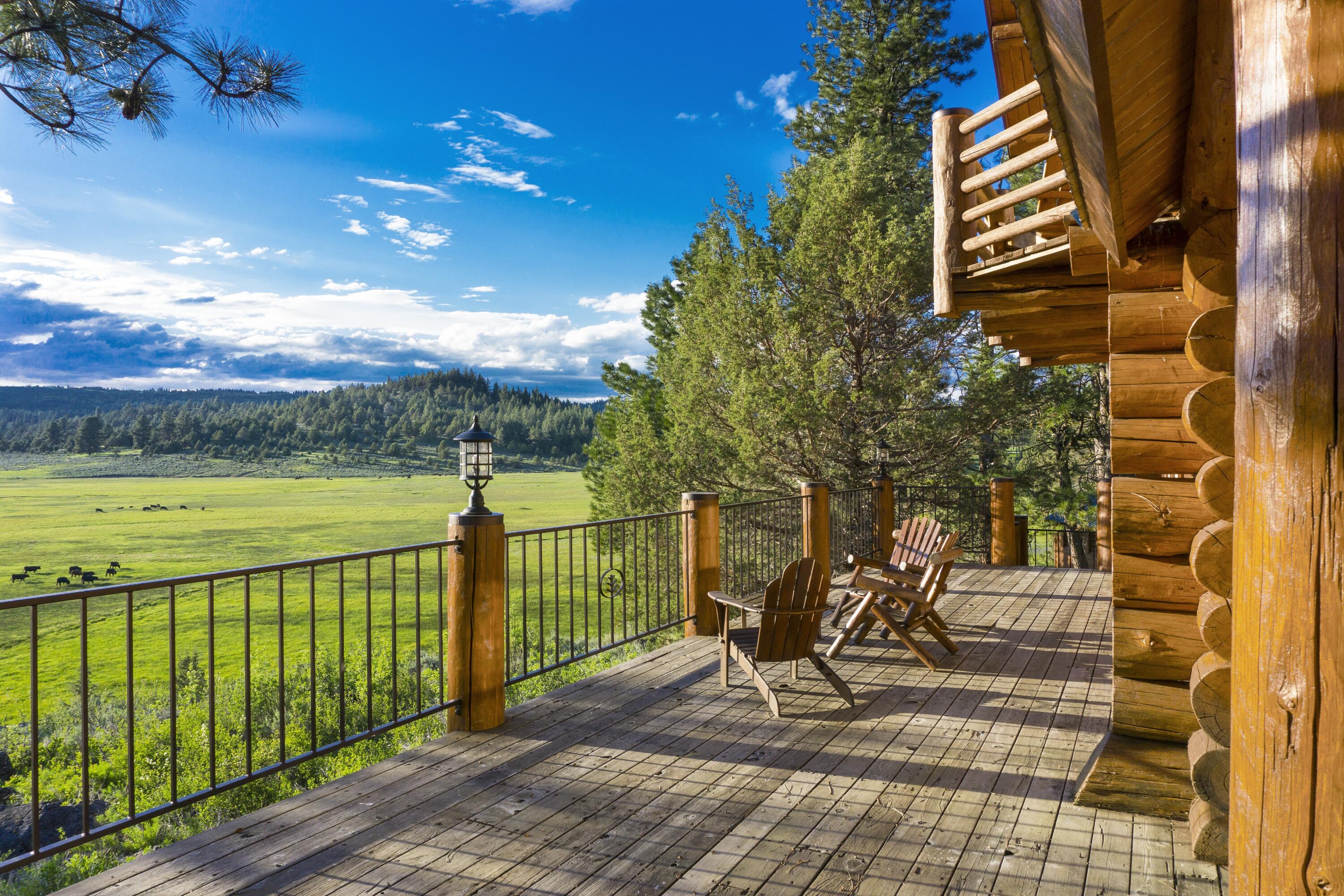 0 Fishhole Creek Road Bly, OR 97622 - Photo 4 of 38 log cabin deck overlooking ranch meadow