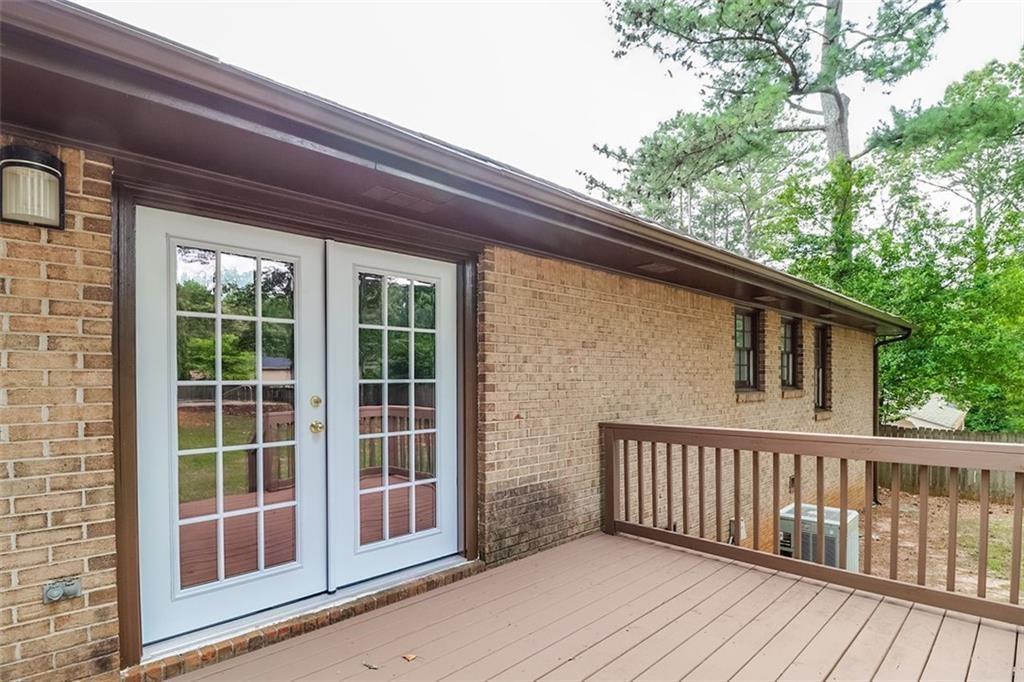 1291 Stephens Street Southwest Lilburn, GA 30047 - Photo 7 of 22 a view of balcony with wooden floor