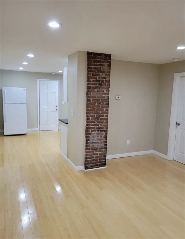 8 Marvel Street, Unit 2 Taunton, MA 02780 - Photo 12 of 17 a view of an empty room with a cabinet