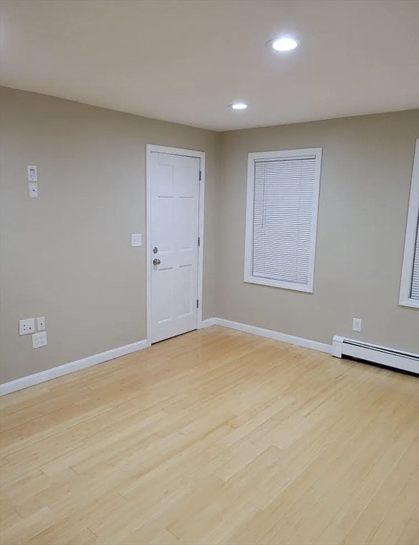 8 Marvel Street, Unit 2 Taunton, MA 02780 - Photo 13 of 17 a view of an empty room with a window