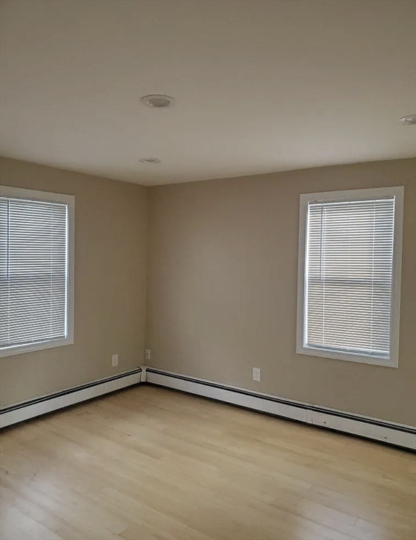 8 Marvel Street, Unit 2 Taunton, MA 02780 - Photo 8 of 17 an empty room with a workbench