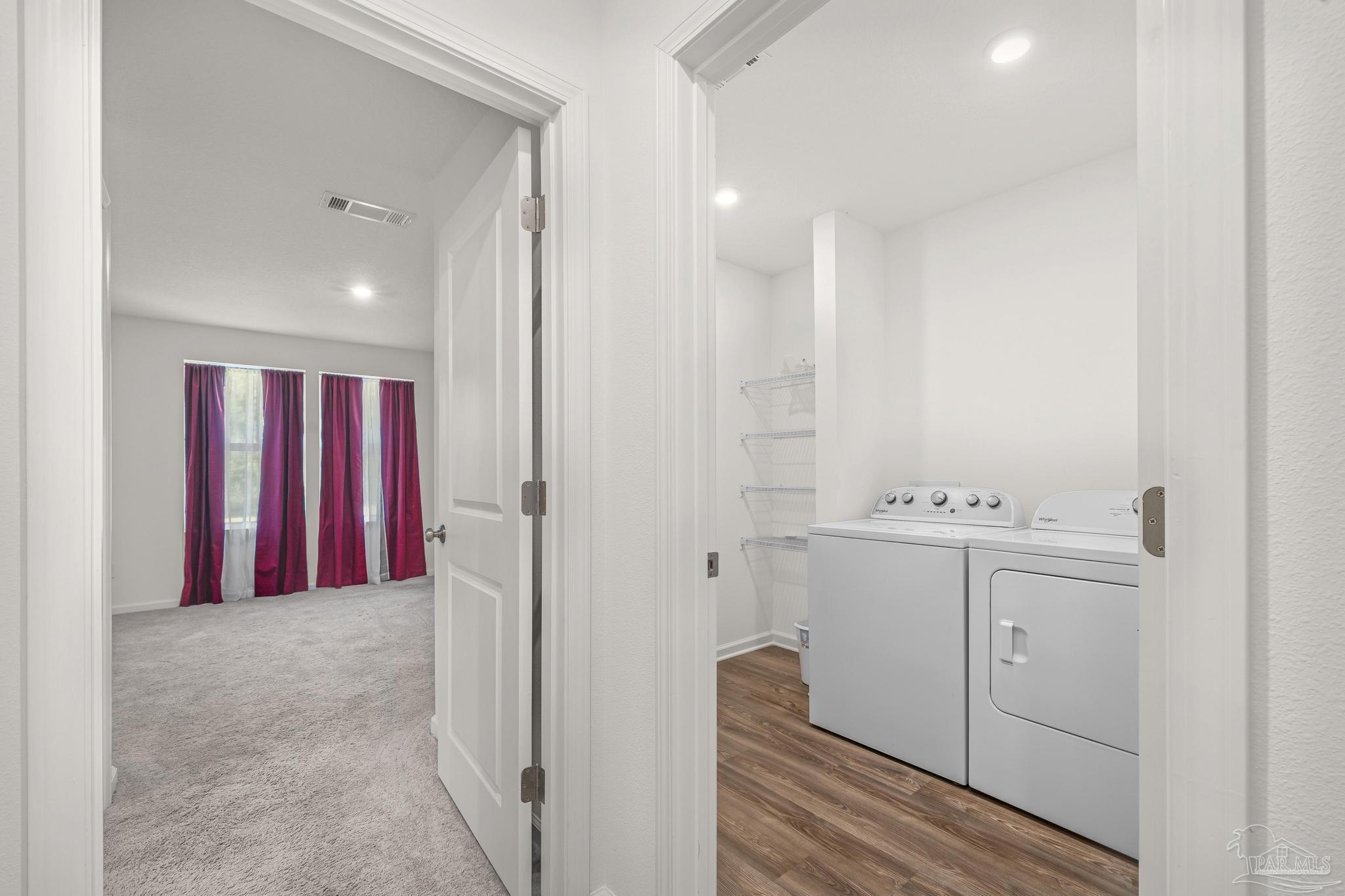 9327 3 Hollow Road Jay, FL 32565 - Photo 15 of 38 laundry in hallway between bedrooms