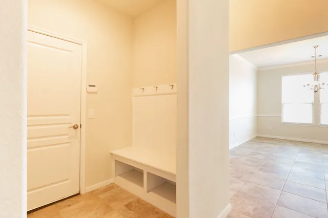 a kitchen with a sink granite counter tops and a window