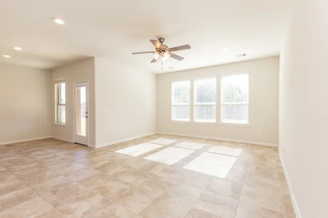 a view of an empty room with a window