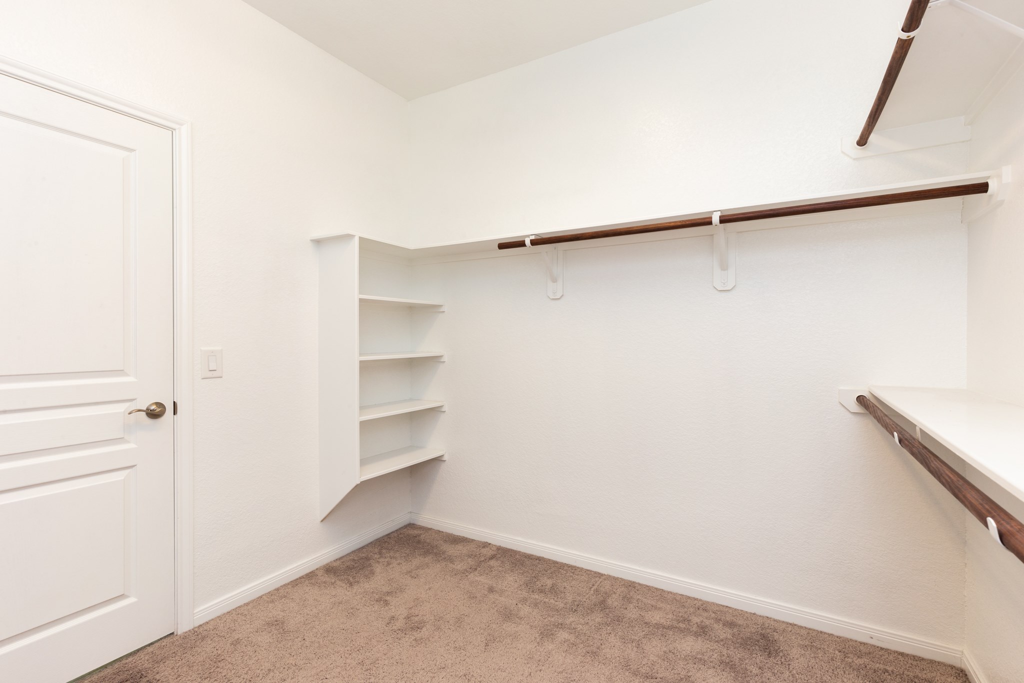 10 Log House Court Tomball, TX 77375 - Photo 34 of 50 a view of an empty walk in closet