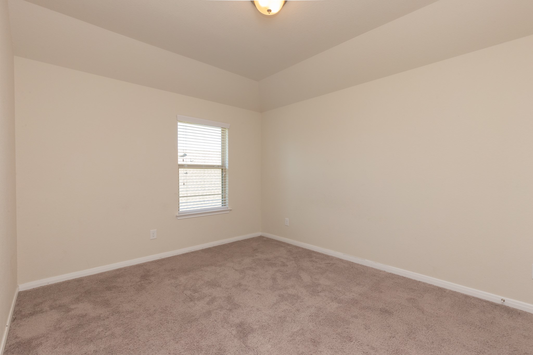 10 Log House Court Tomball, TX 77375 - Photo 35 of 50 an empty room with a window