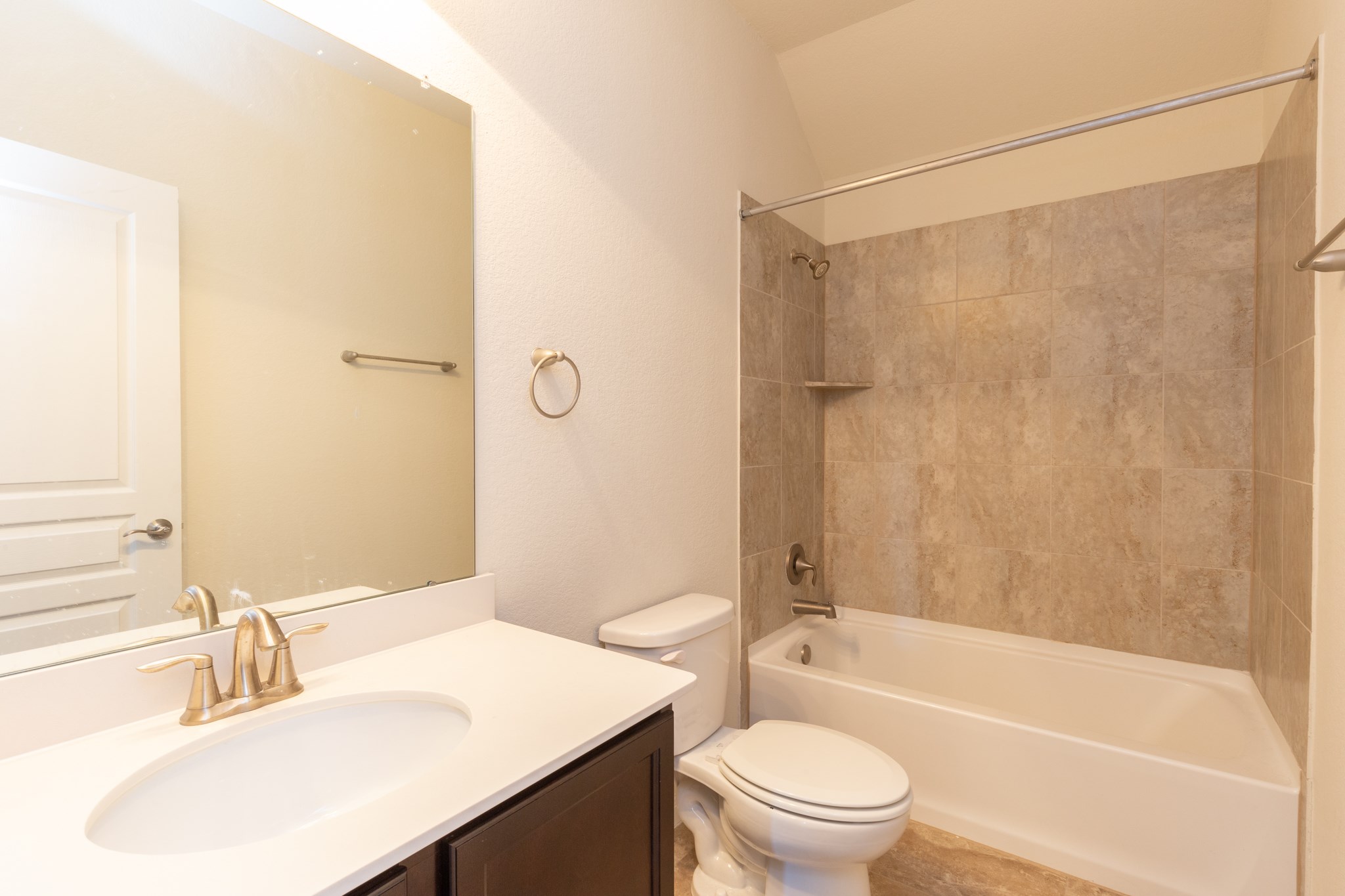 10 Log House Court Tomball, TX 77375 - Photo 42 of 50 a bathroom with a sink a toilet and shower