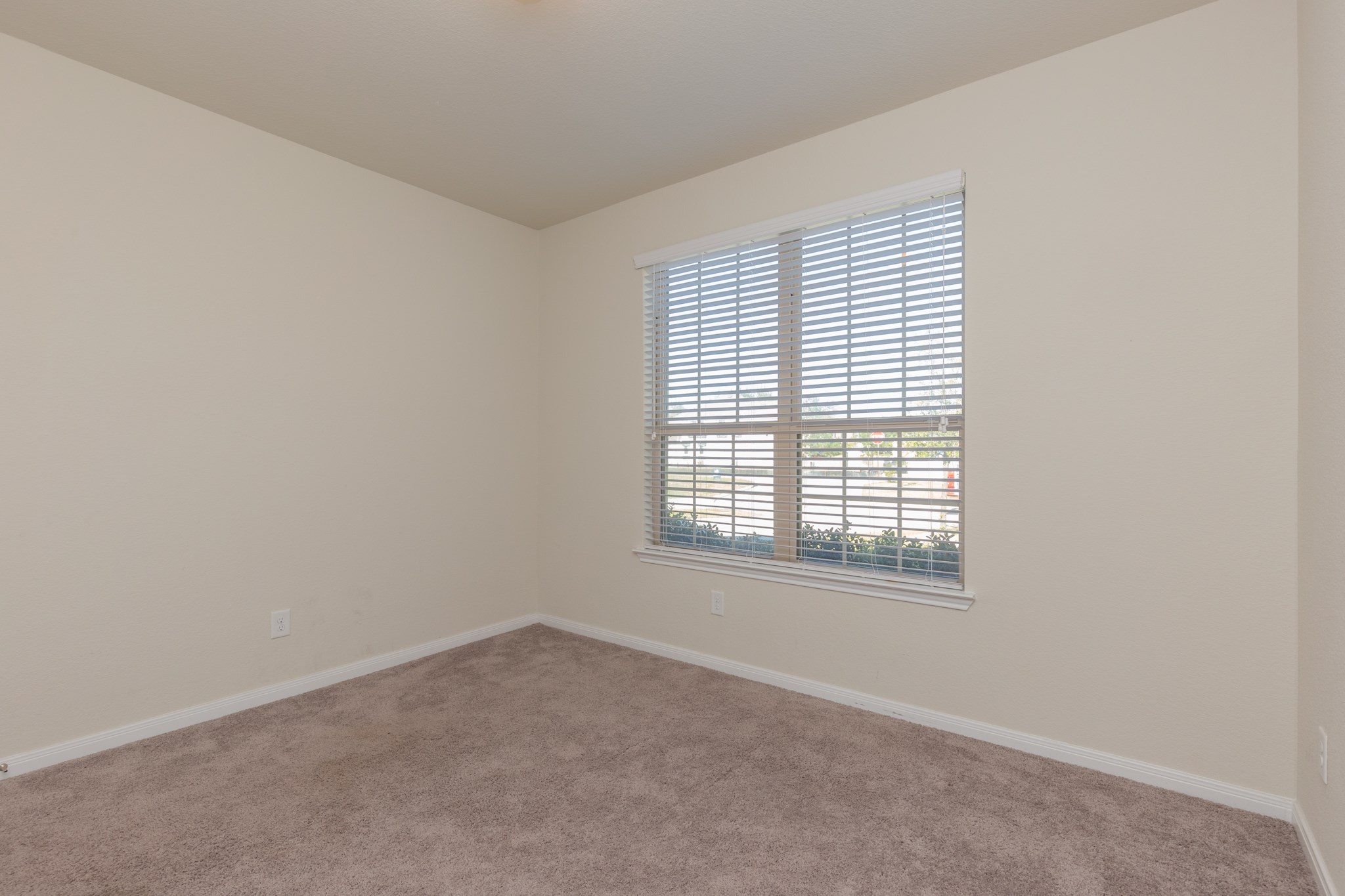 10 Log House Court Tomball, TX 77375 - Photo 6 of 50 an empty room with a window