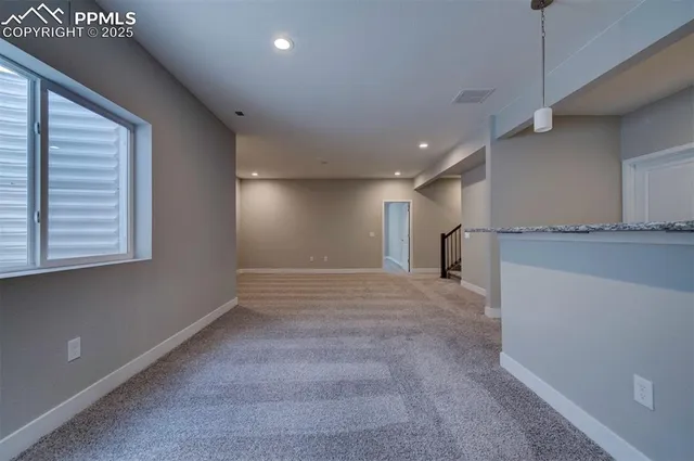 a view of a kitchen with a dishwasher and a window