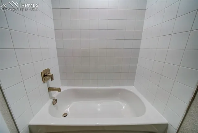 a close view of a bathtub in bathroom