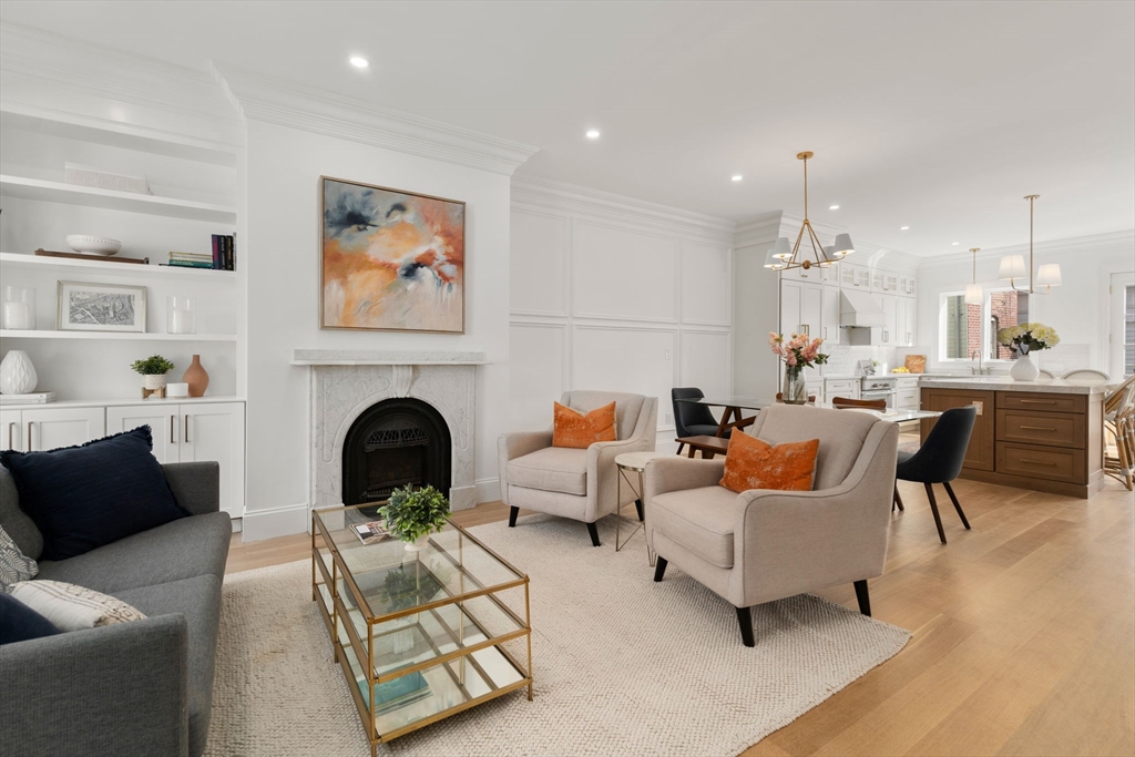 32 High Street Boston, MA 02129 - Photo 13 of 38 a living room with furniture and a fireplace