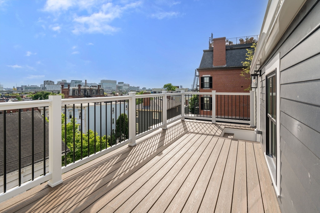32 High Street Boston, MA 02129 - Photo 28 of 38 a view of balcony with wooden floor and fence