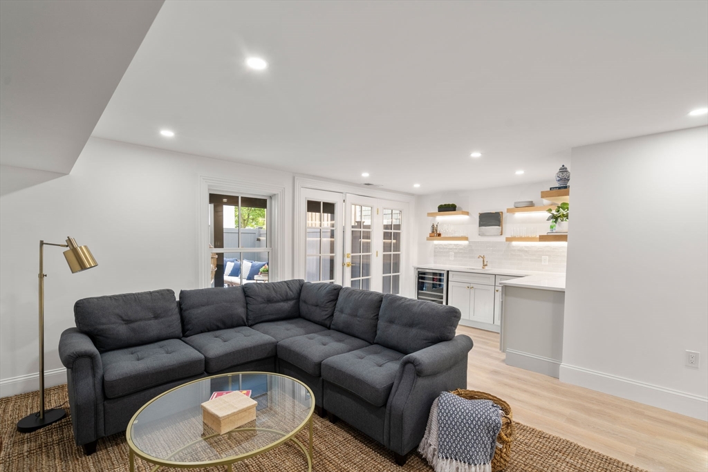 32 High Street Boston, MA 02129 - Photo 30 of 38 a living room with furniture and kitchen view