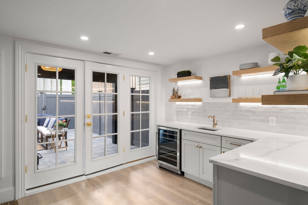 32 High Street Boston, MA 02129 - Photo 32 of 38 a kitchen with stainless steel appliances granite countertop a sink and wooden cabinets