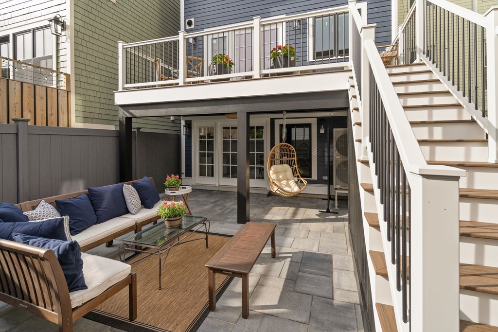 32 High Street Boston, MA 02129 - Photo 35 of 38 a view of a patio with couches table and chairs and wooden floor