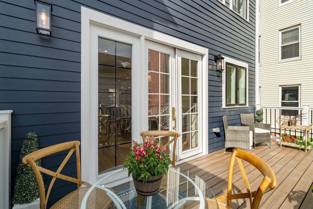 32 High Street Boston, MA 02129 - Photo 8 of 38 a view of a house with a backyard and sitting area