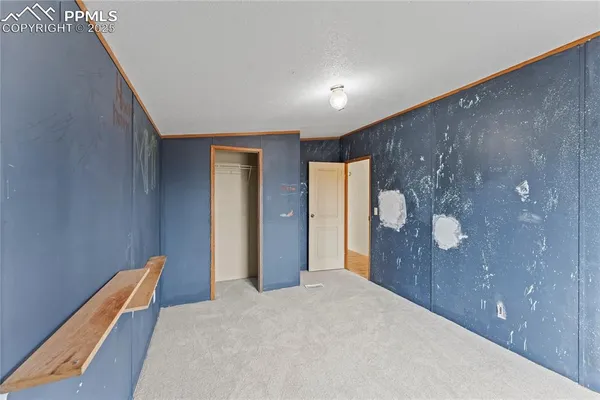 a view of a hallway with closet