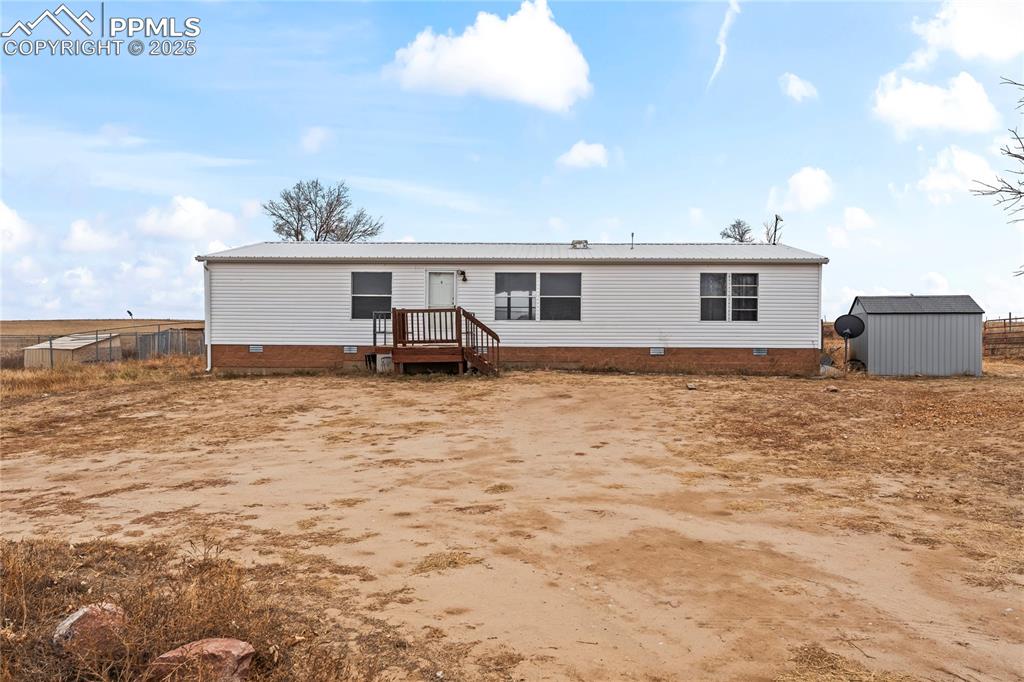 41275 Truckton Road Rush, CO 80833 - Photo 22 of 32 a view of a house with a backyard