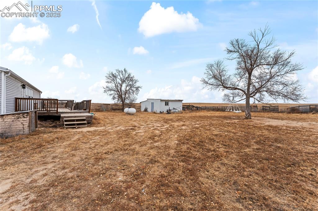 41275 Truckton Road Rush, CO 80833 - Photo 23 of 32 a view of a yard with wooden fence